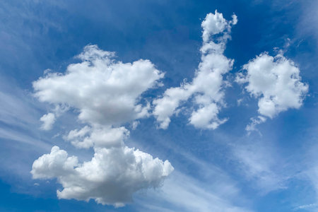 White clouds in blue sky. Beautiful fluffy clouds on blue heaven backgroundの写真素材