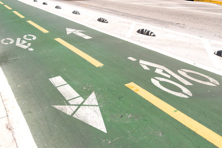 Miami, Florida - August 25th, 2023: Protected green empty bike lane on a street.のeditorial素材