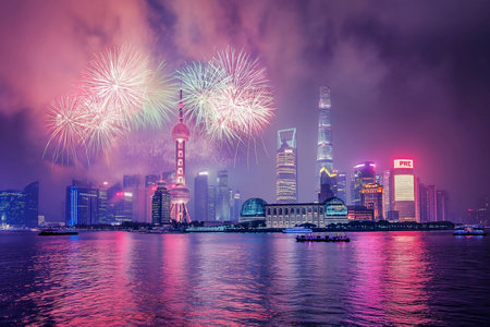 Shanghai skyline with fireworks at night. Shanghai is the capital of China.の素材