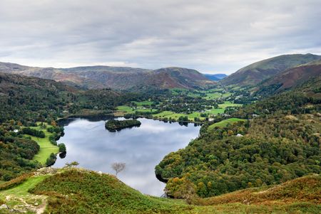 An aerial view of Grasmere in the English Lake district as seen from the slopes of Loughrigg. Grasmere village & Dunmail Raise can be seen in the distanceの写真素材