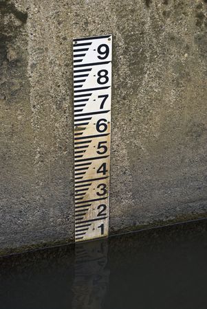 A water depth marker in a riverの写真素材
