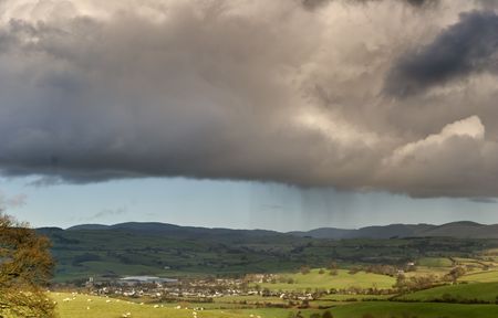 A rain shower falling from Cumulus clouds