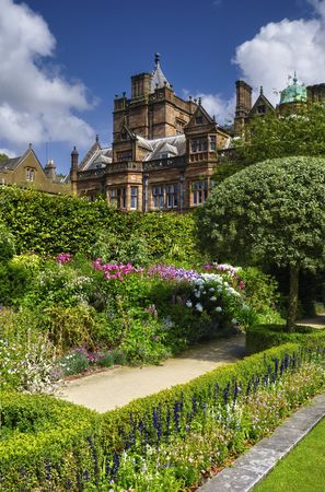 Exterior of luxurious English country house with garden in foreground.の写真素材