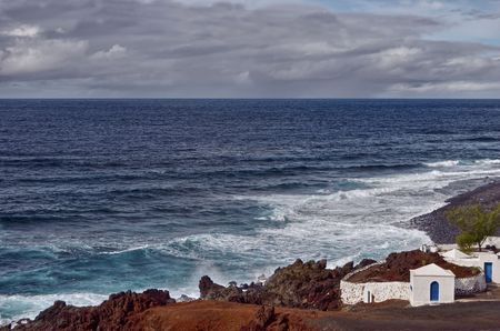 Scenic view of volcanic coastline, El Golfo, Lanzarote, Canary Islands, Spain.の写真素材