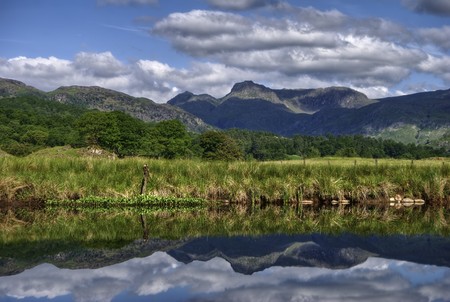The Langdale Pikes reflected in river Brathay at Elterwater, the English Lake Districtの写真素材