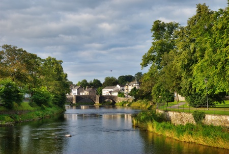 The River Kent, Kendal, Cumbria, England, with Nether bridge in the distanceの写真素材