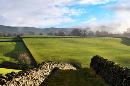 a path through dry-stone walls, Staveley, Cumbria, in the English lake Districtの写真素材