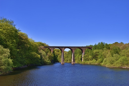 Scenic view of Victorian railway viaduct in English countryside.の写真素材