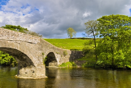 An ancient packhorse bridge on the river Lune near Beck Foot, Cumbria.
