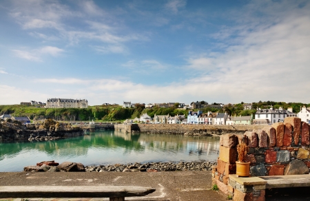 Tranquil view of houses around Portpatrick harbour in southwest Scotland, on a beautiful summers dayの写真素材