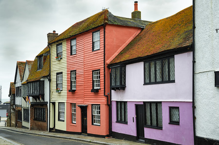 A street in the old town area of Hastings, East Sussex, England with traditional colourful painted house and cottages.の写真素材