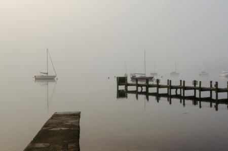 A foggy morning on Windermere.の写真素材