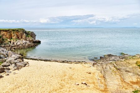 A secluded sandy bay on Heysham Head, a promitory near Morecambe, Lancashire, Northern Englandの写真素材
