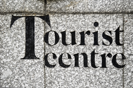 Tourist center inscribed on a stone wallの写真素材