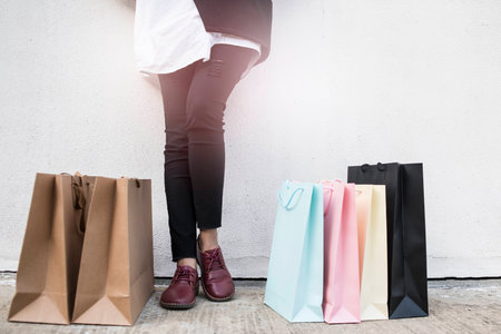 Woman and multi colored shopping bagの写真素材