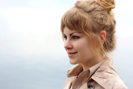 Woman looking into the distance of natureの写真素材