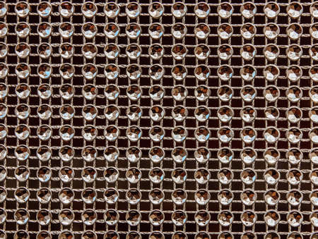 Shiny lace with imitation sparkling stones. Beautiful background.