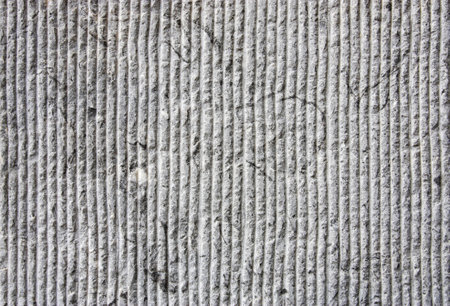 Grey stone wall texture. Texture of stone wall with lines. Modern stone or concrete background.の写真素材