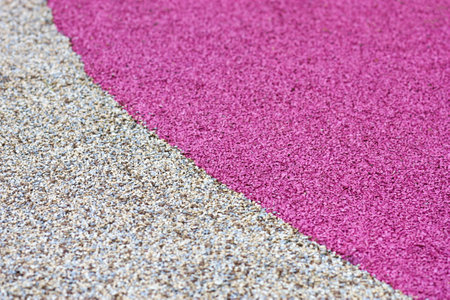 Safety cover of pink and beige crumb rubber for playgroundsの写真素材