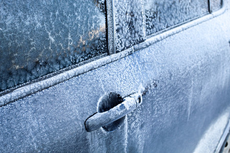 Car covered with ice and icicles. Ice covered car window.の写真素材