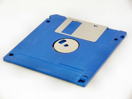 Vintage 3½-inch blue computer floppy disk with metal inlayの写真素材