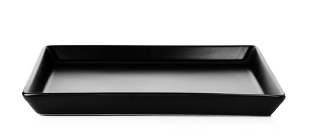 Black plate isolated on a white .の写真素材