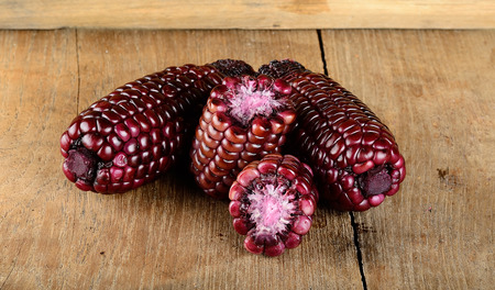 Red corn on the wooden background .の写真素材