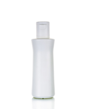 Blank white plastic cosmetics bottle isolated on whiteの写真素材