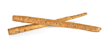 Burdock roots isolated on the white background.の写真素材