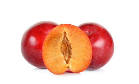 Red plum fruit with half isolated on white background.の写真素材
