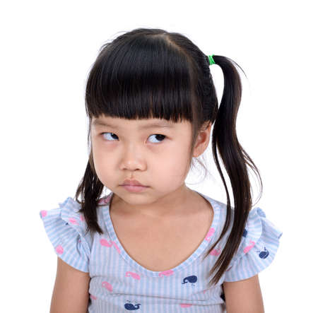 Asian little girl smile with beutiful teeth isolated on white backgroundの写真素材