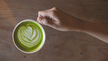 hot green tea latte art in the cafe shopの写真素材