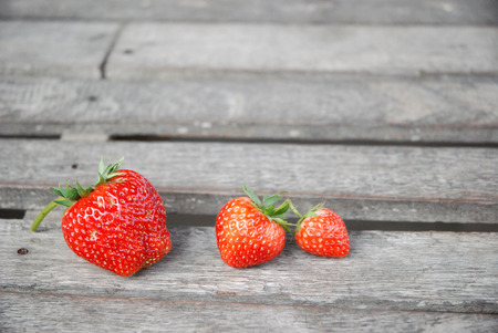 Strawberry berry red on woodの写真素材