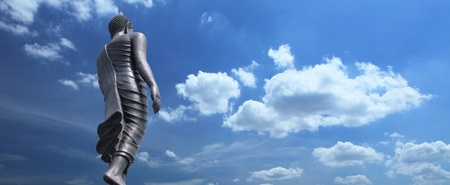 Buddha statue on blue sky backgroundの写真素材
