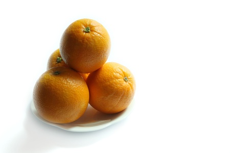 sunkist orange on white plateの写真素材