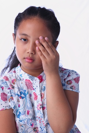 girl pain her eyeの写真素材