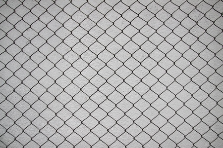 iron net and cement wallの写真素材