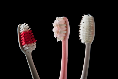 used of tooth brush isolated blackの写真素材