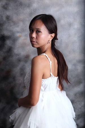women with white dress bride in studio lightの写真素材