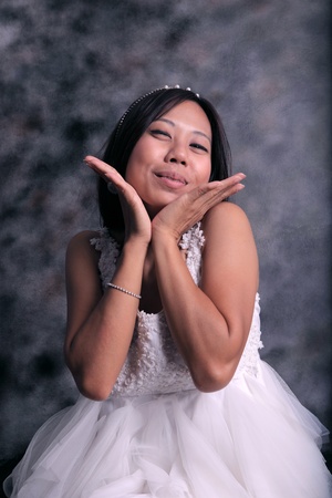women in white dress bride happiness action in studioの写真素材