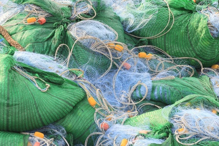 net for catching fish package in boatの写真素材