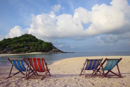 four of wood chairs beach at sea sideの写真素材