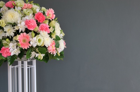 wedding flowers decorated in front of gray color wall backgroundの写真素材