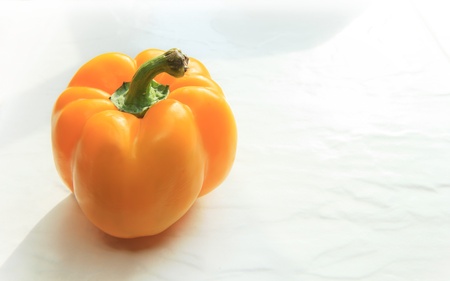 yellow sweet chilli paprika on white backgroundの写真素材