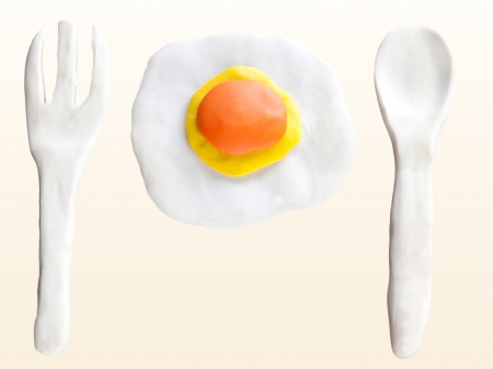 fried egg fork and spoon made from clay sculpture designの写真素材