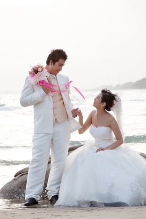 groom and bride on sea beachの写真素材