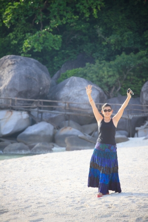women with glad emotion standing on sea beach の写真素材