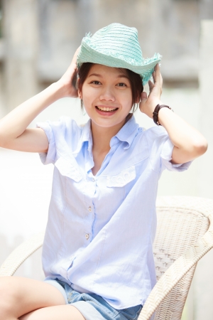 asian woman wearing a hat with smiling faceの写真素材