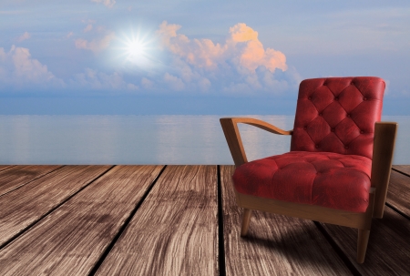 red  arm chairs on wood terrace and sun rise の写真素材