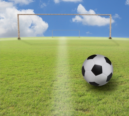 soccer football and green grass fieldの写真素材